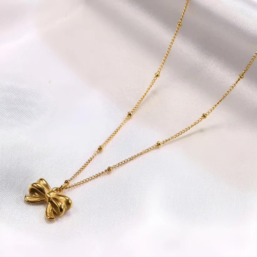 gold_dainty_bow_pendant_necklace-1.jpg gold_dainty_bow_pendant_necklace-1.jpg